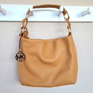 Michael Kors Tan and Gold purse zippered closure